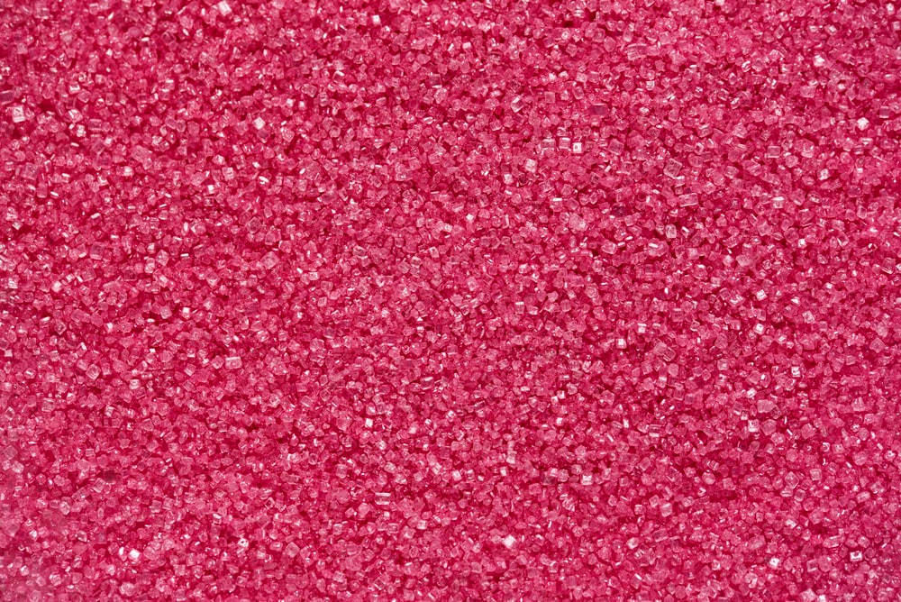 Aesthetic Deep Pink Crystal Beads Sparkling In The Light Background