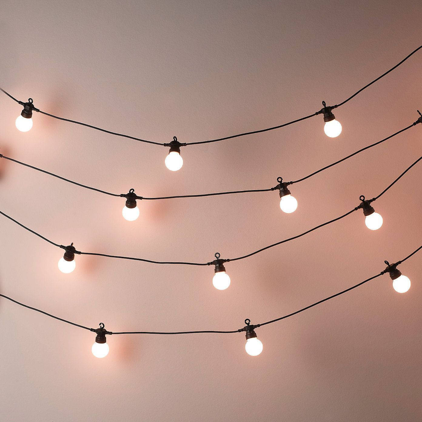 Aesthetic Fairy Lights In White Wall Background