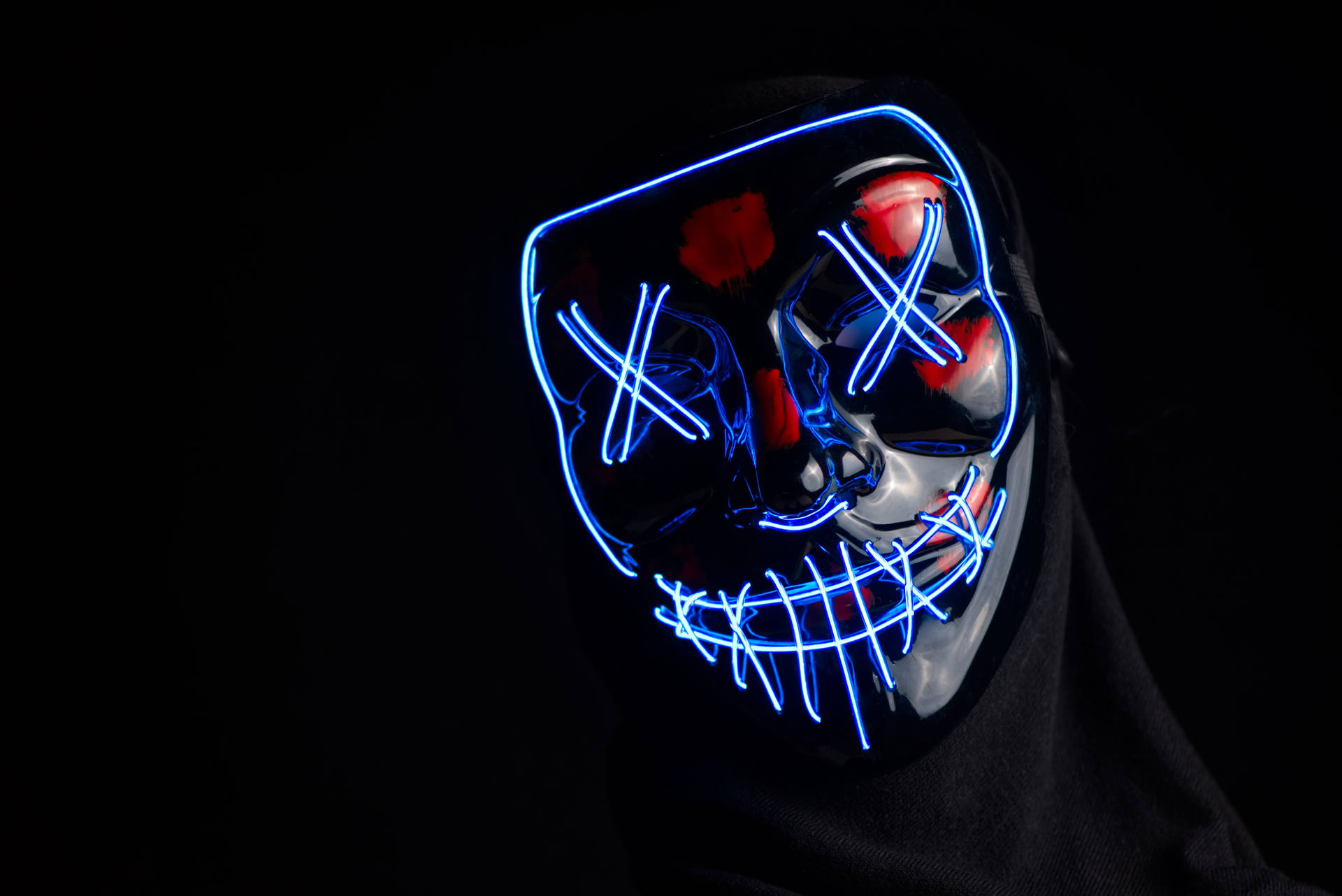 Aesthetic Hacker Logo Illuminated On A Dark Digital Background