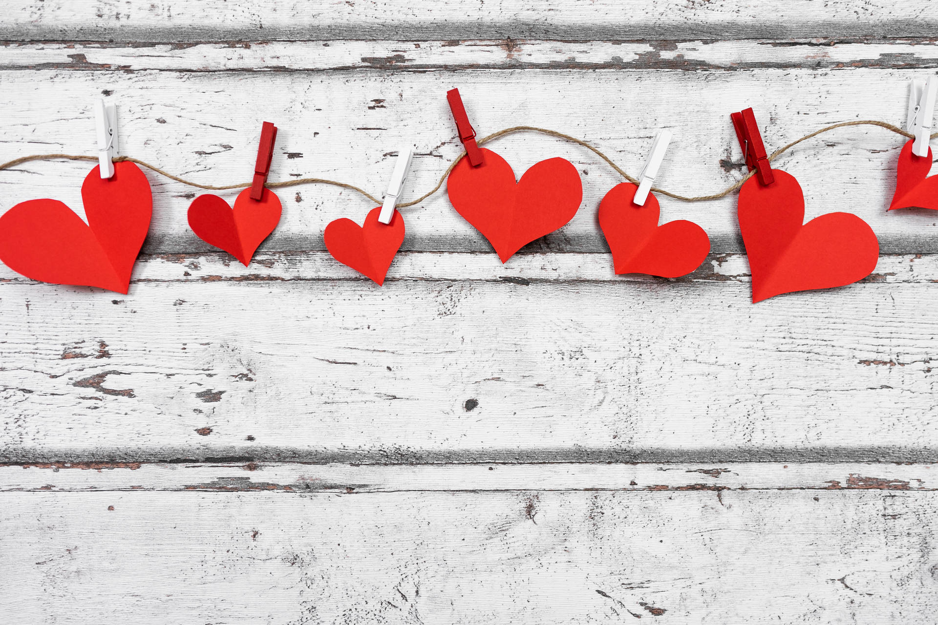 Aesthetic Heart Paper Cutouts On String Background