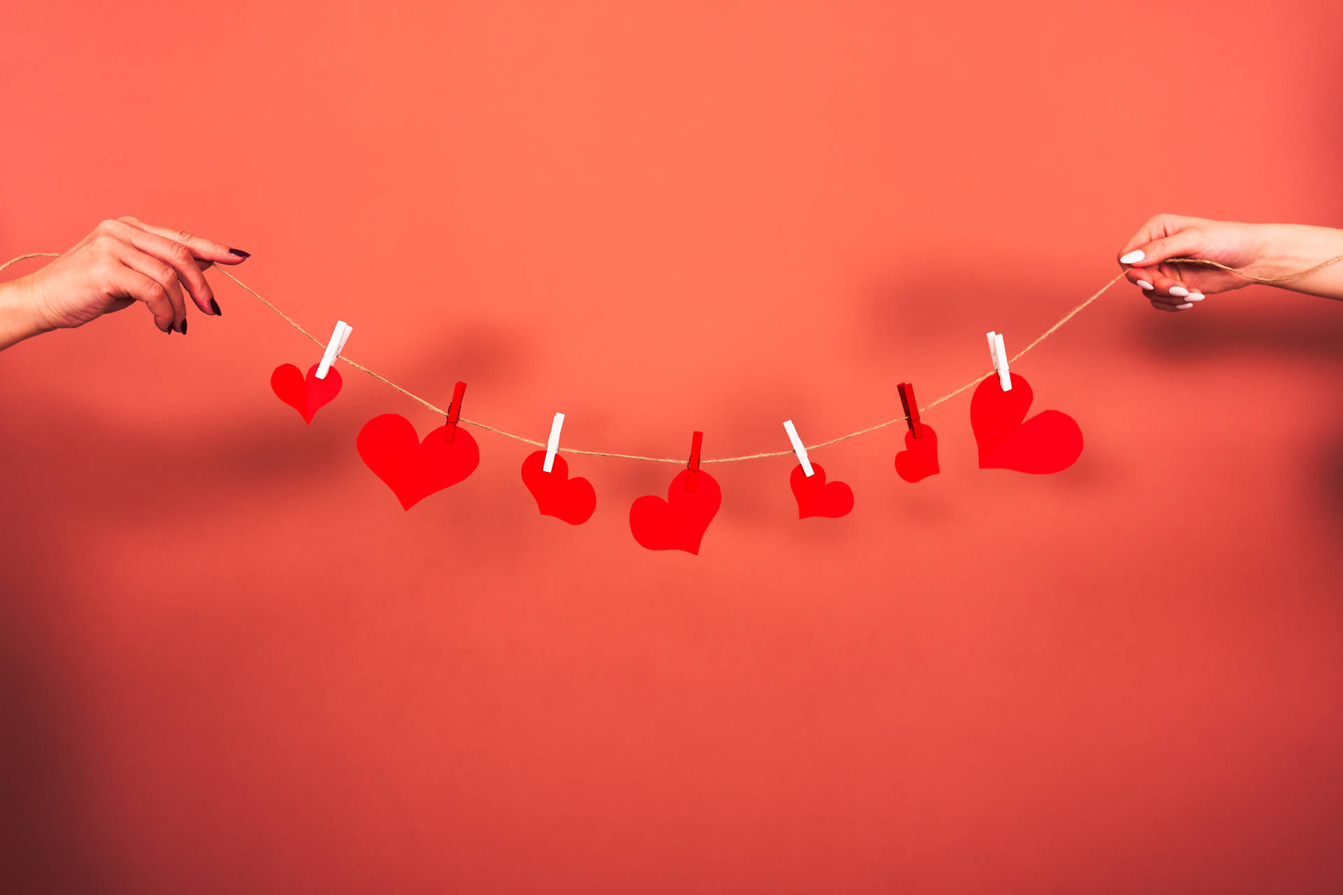 Aesthetic Heart Shapes On A String Background