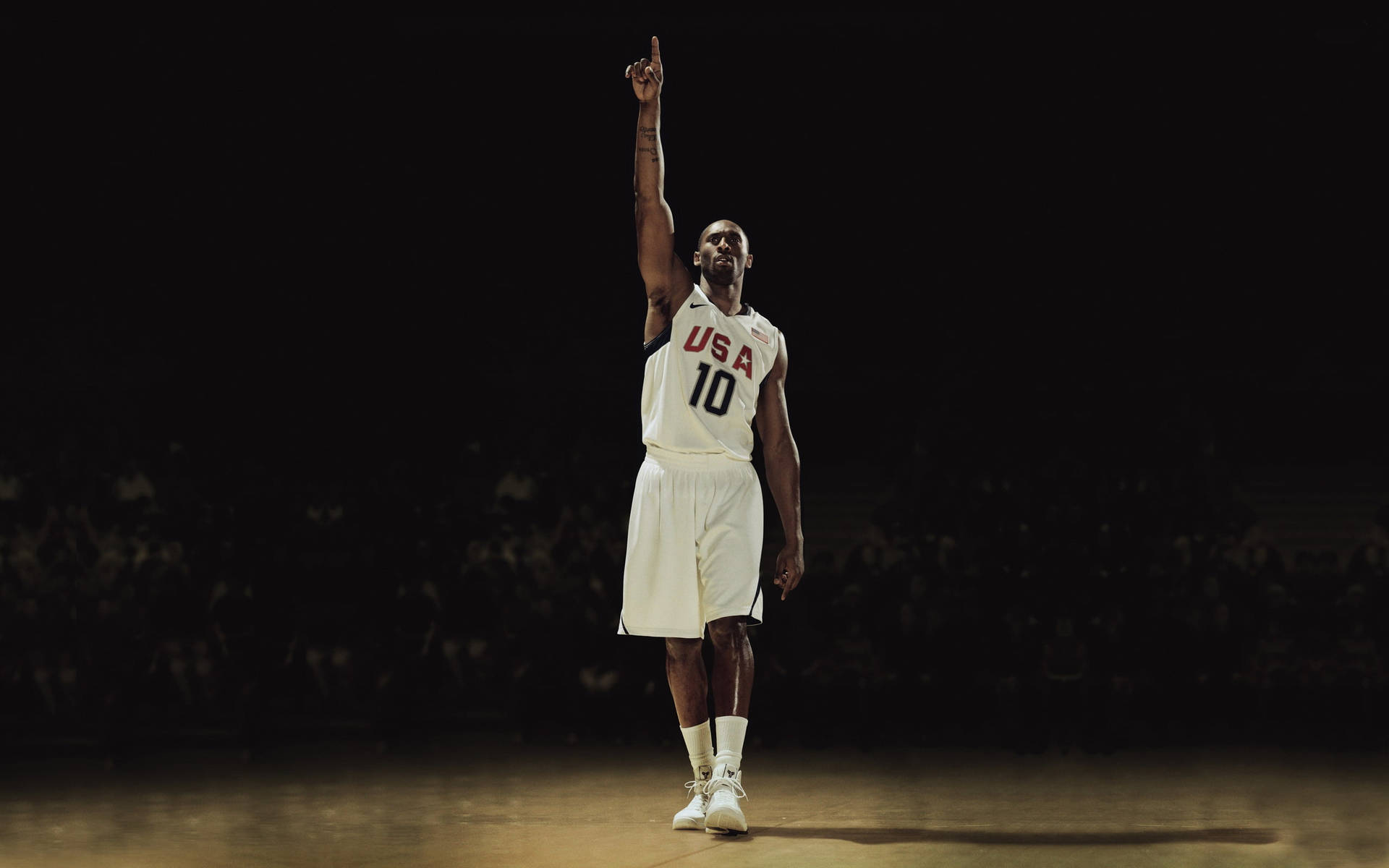 Aesthetic Kobe Bryant Raising A Hand Background