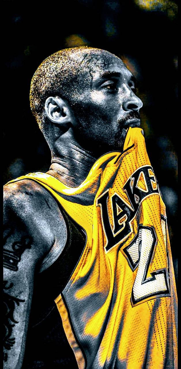 Aesthetic Kobe Bryant Side Profile Biting His Jersey Background