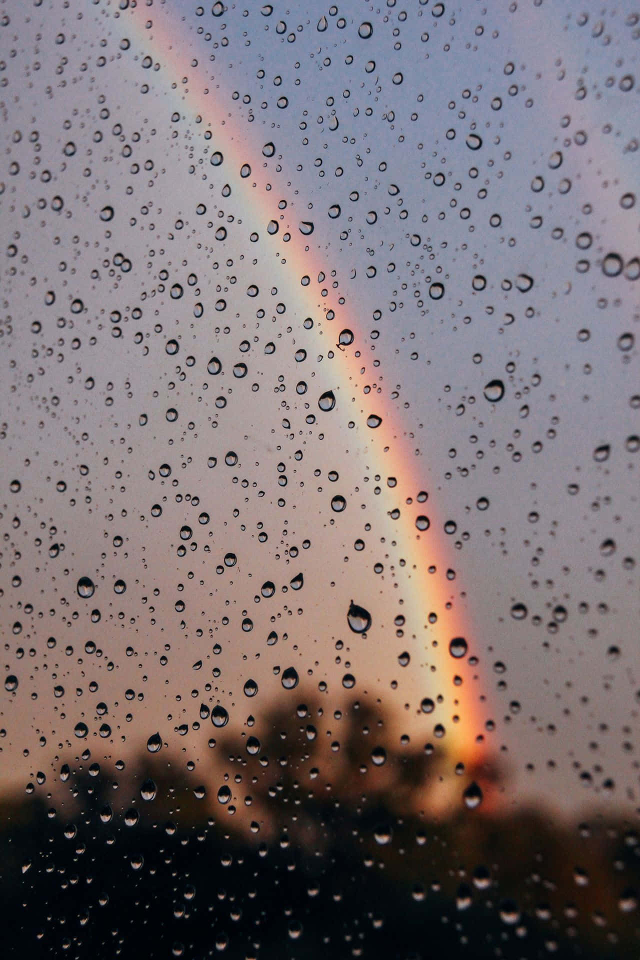 Aesthetic Rainbow Behind Wet Window Background