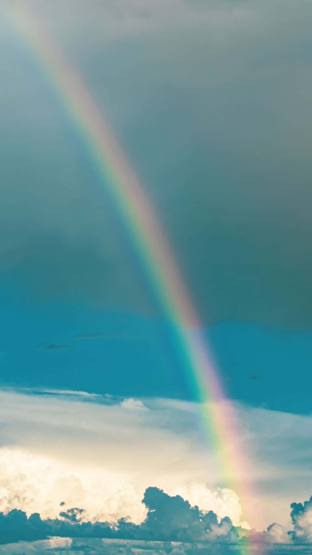 Aesthetic Rainbow Mobile Above The Clouds Background