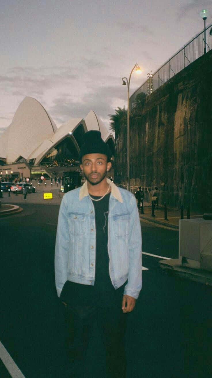 Aesthetic Rapper Poised For A Performance Background