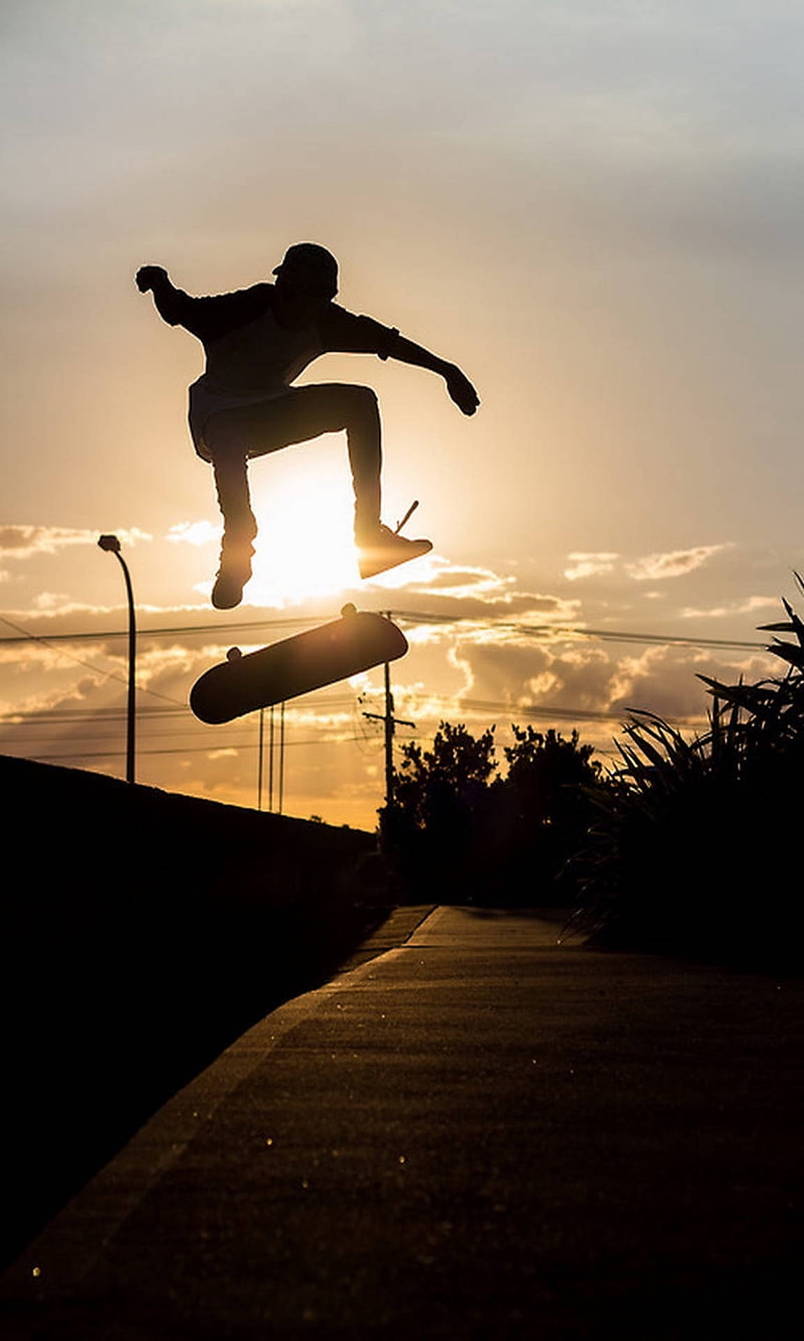 Aesthetic Skater Boy Sunset Silhouette Background