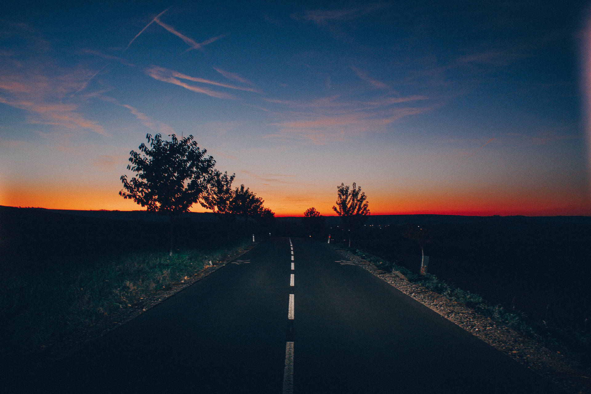 Aesthetic Sky Above Empty Road With Trees Background