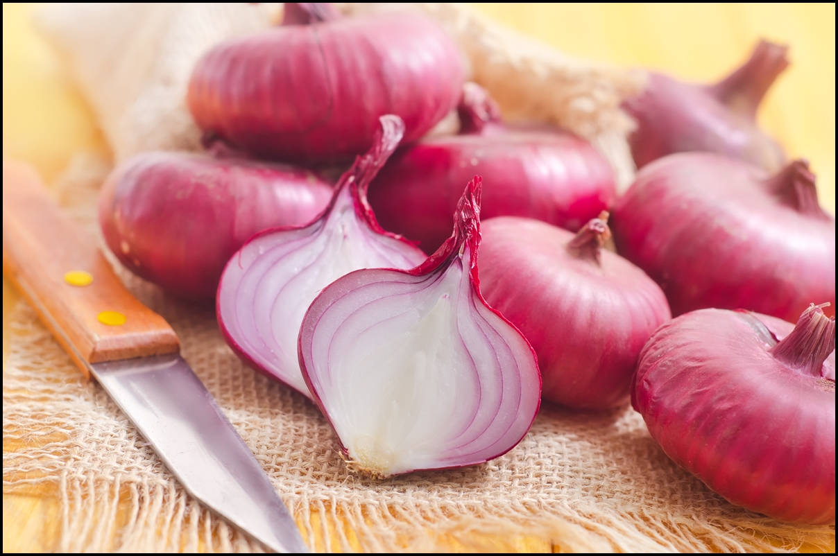 Aesthetic Sliced And Whole Red Onions With Knife Background