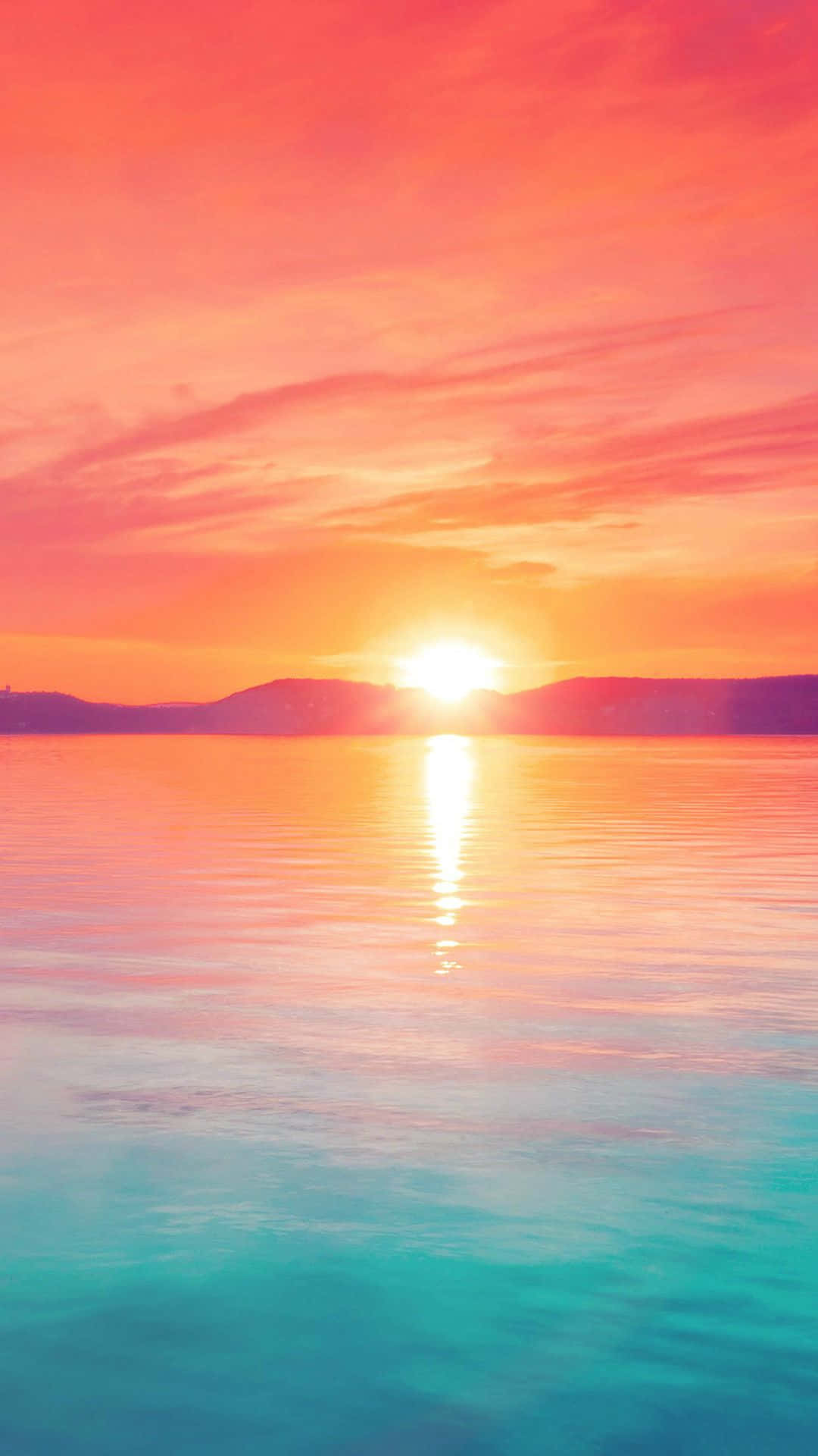Aesthetic Sunset Iphone With Sun Reflecting On Blue Ocean Background