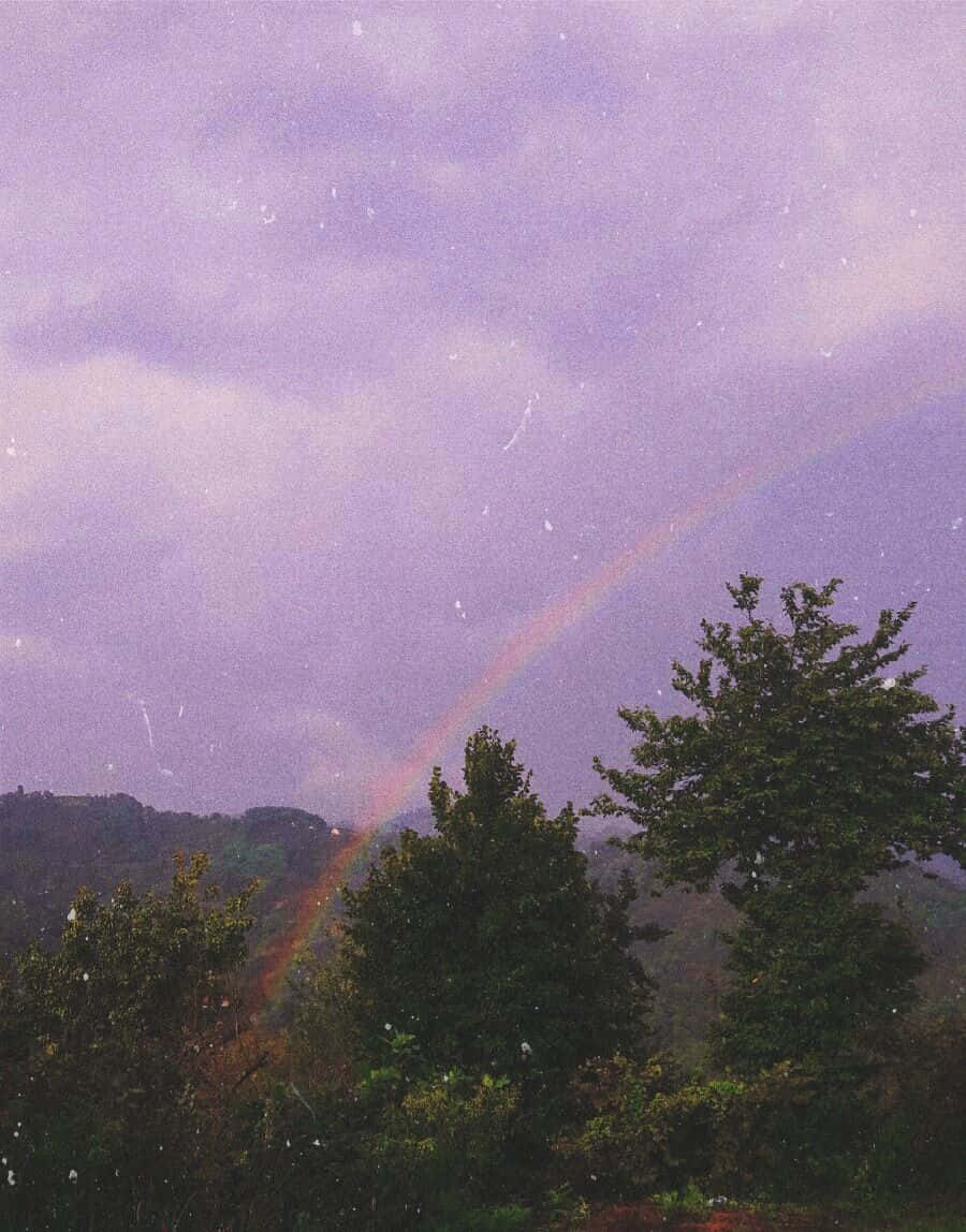 Aesthetic Vintage Purple Sky And Rainbow Background
