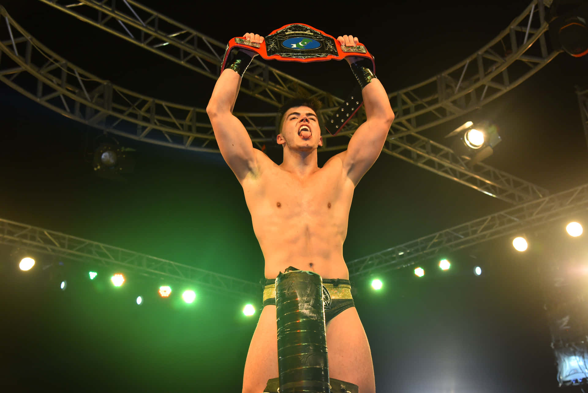 Aew Star Sammy Guevara Triumphantly Holding A Championship Belt