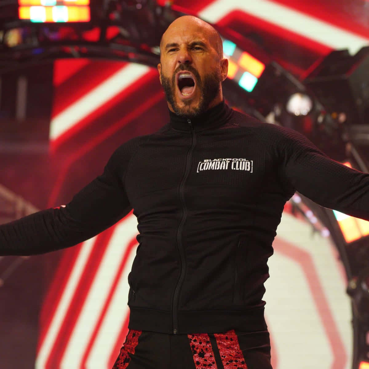 Aew Wrestler Claudio Castagnoli Showcasing His Wrestling Prowess. Background