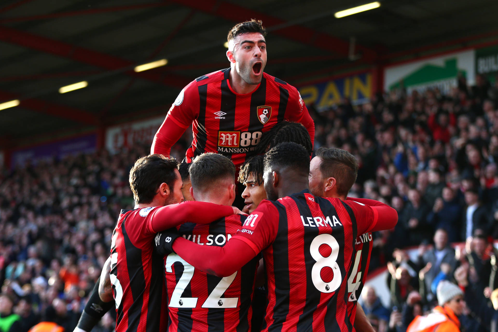 Afc Bournemouth Football Players Tight Huddle Background