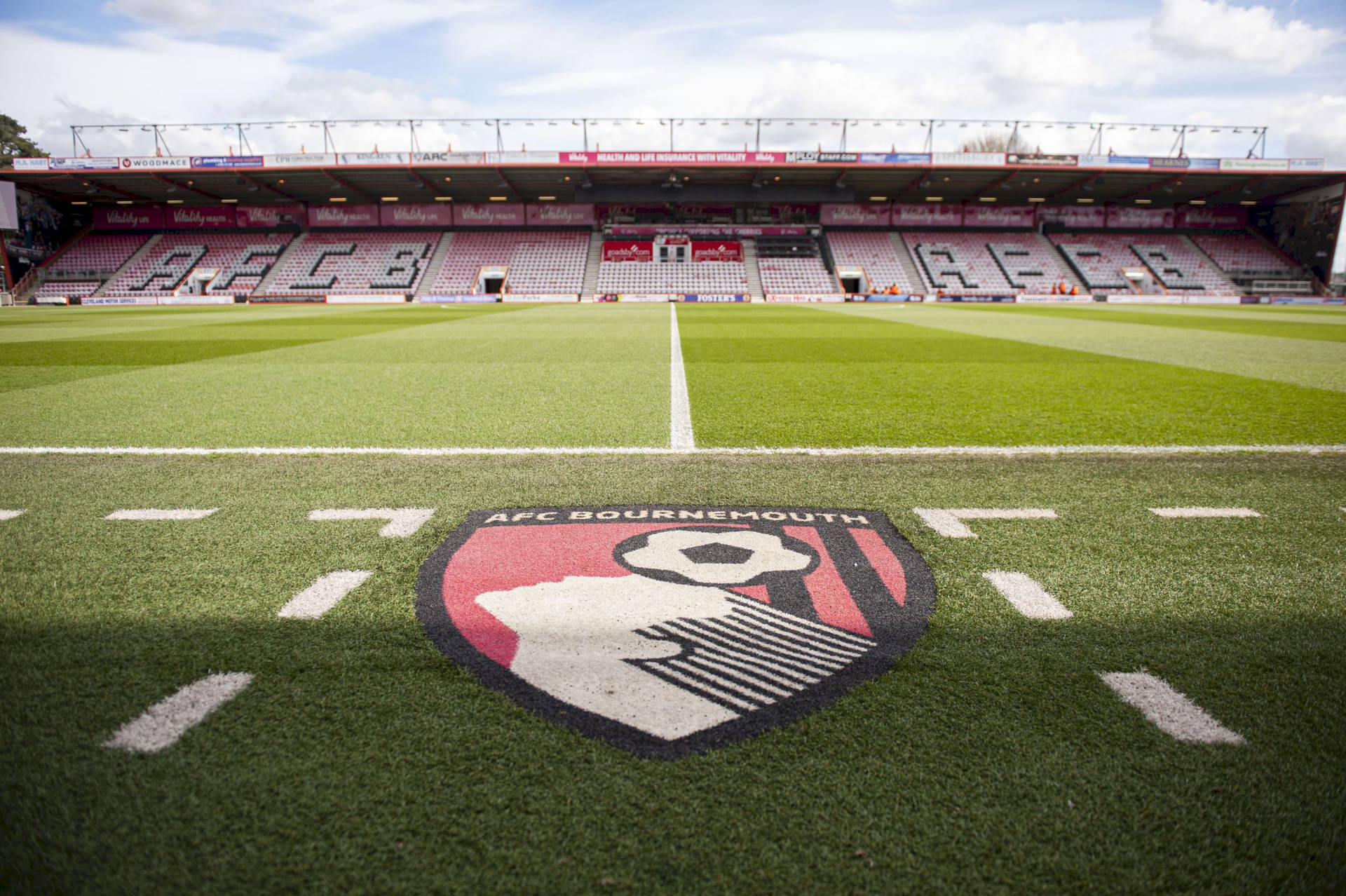 Afc Bournemouth Logo On The Field Background