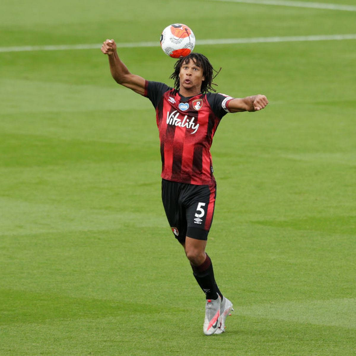 Afc Bournemouth Nathan Ake Catching Ball Background