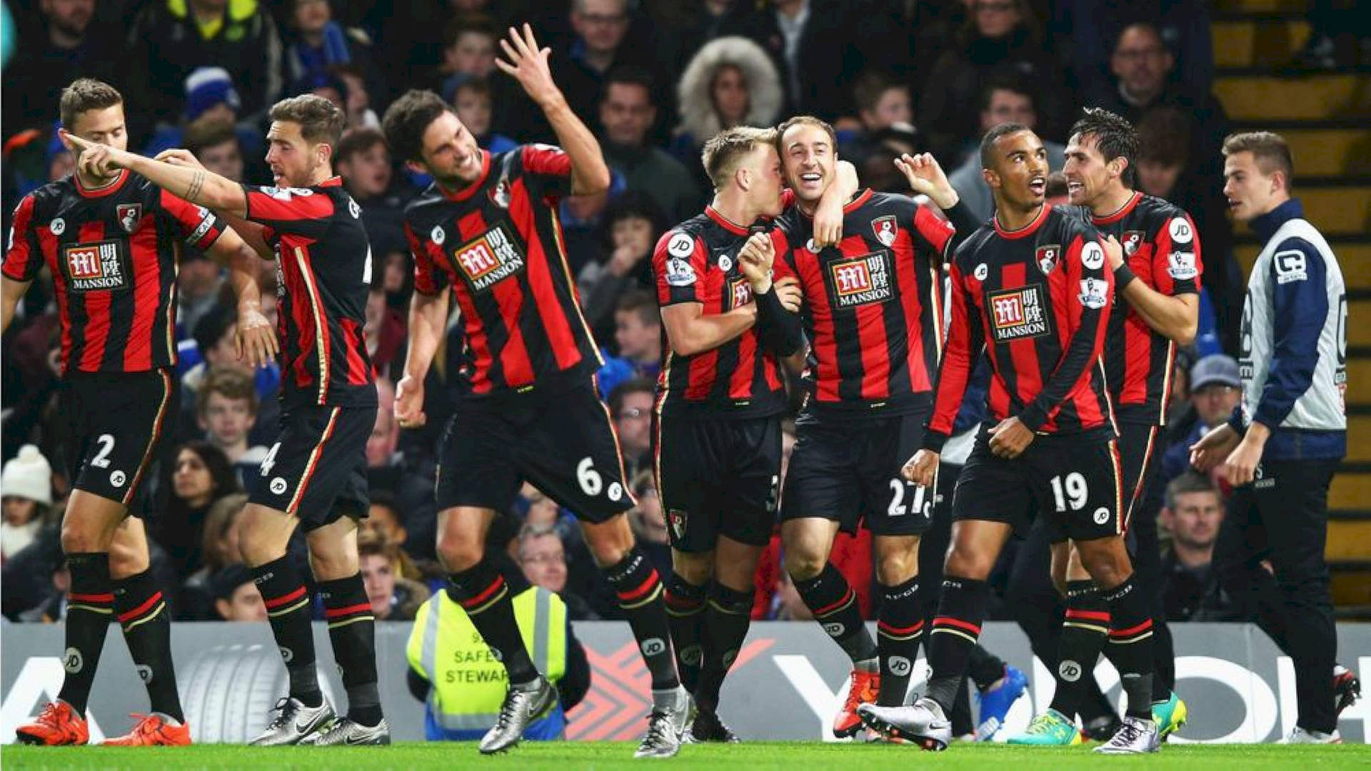 Afc Bournemouth Players Cheering Inside Stadium Background