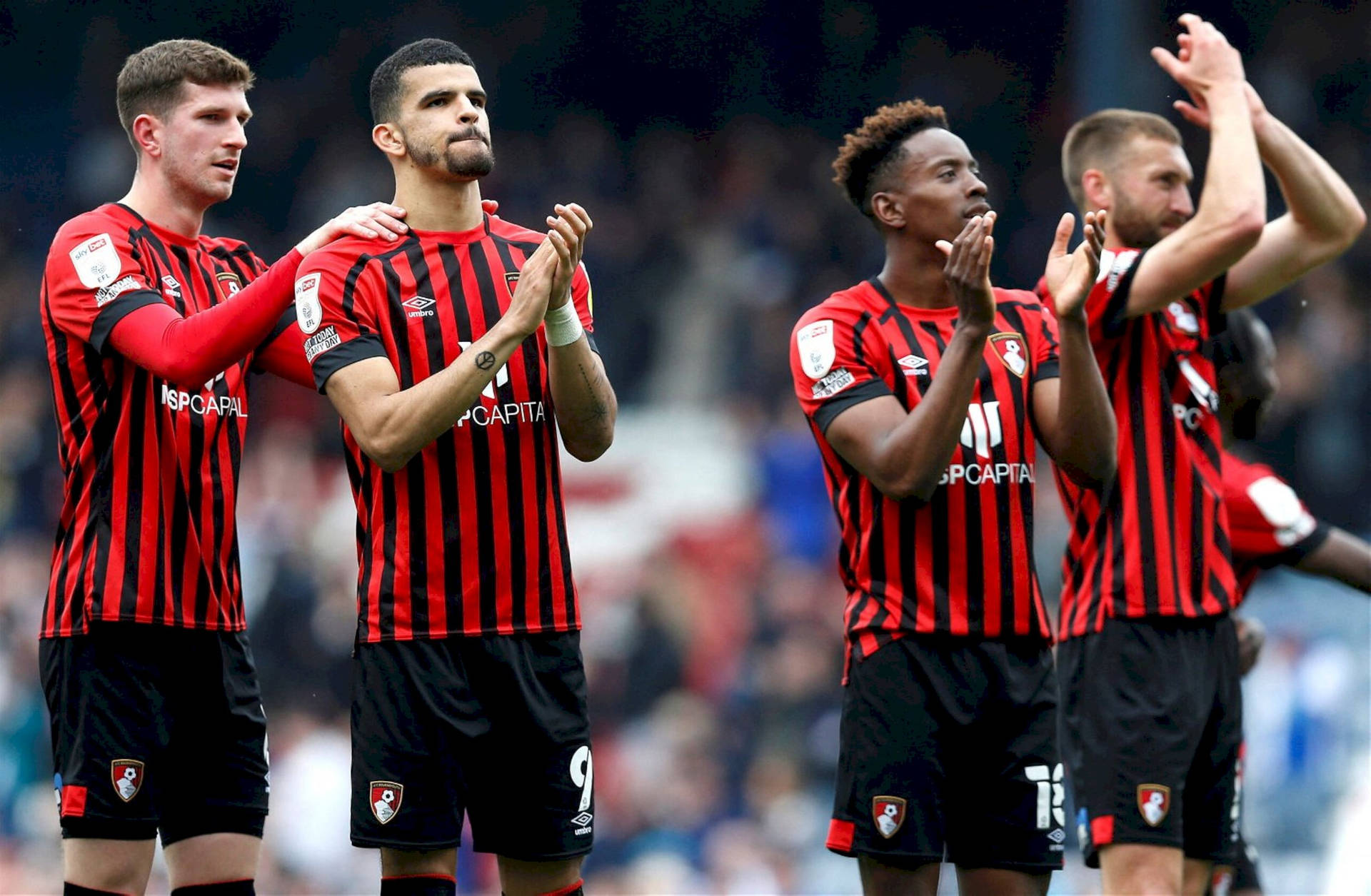 Afc Bournemouth Players Clapping In Stadium Background