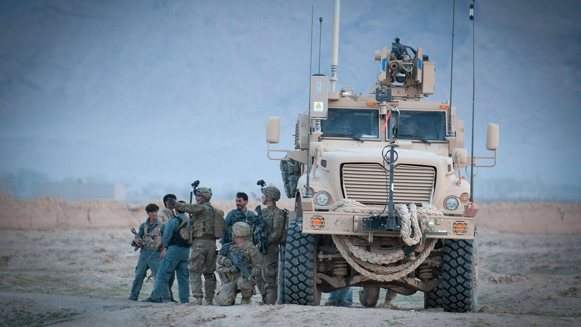 Afghanistan Troops With Vehicle Background