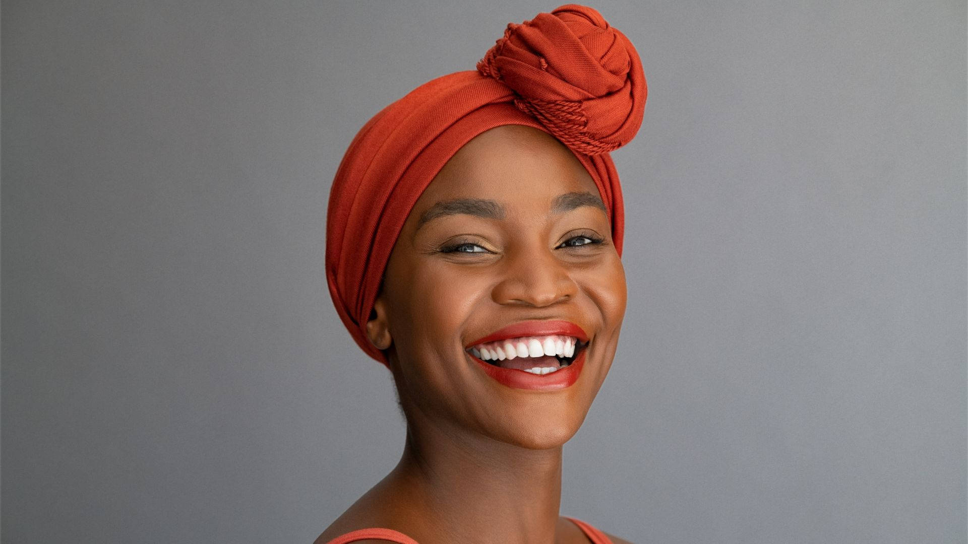 African Woman Wearing Orange Headscarf