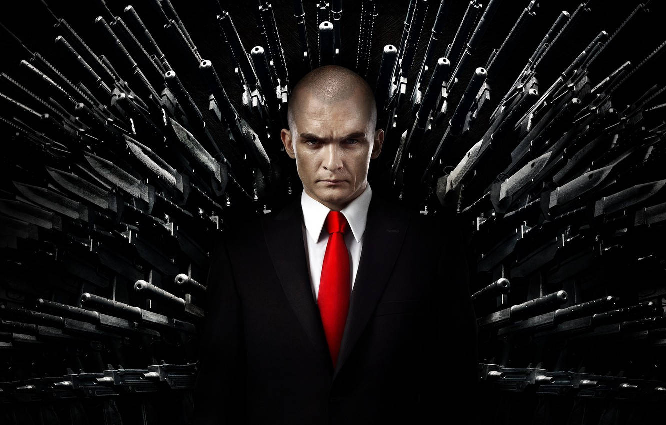 Agent 47 In His Signature Black Suit Background