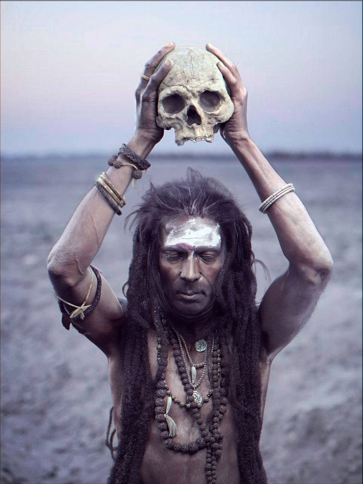 Aghori With Ritual Skull Background