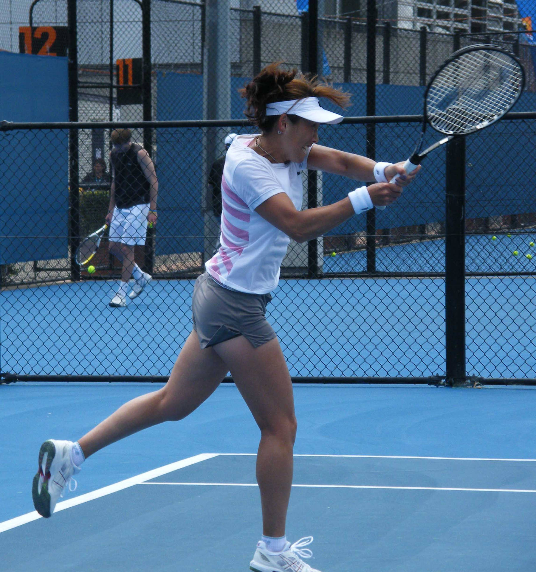 Ai Sugiyama Practicing At A Tennis Training Facility. Background