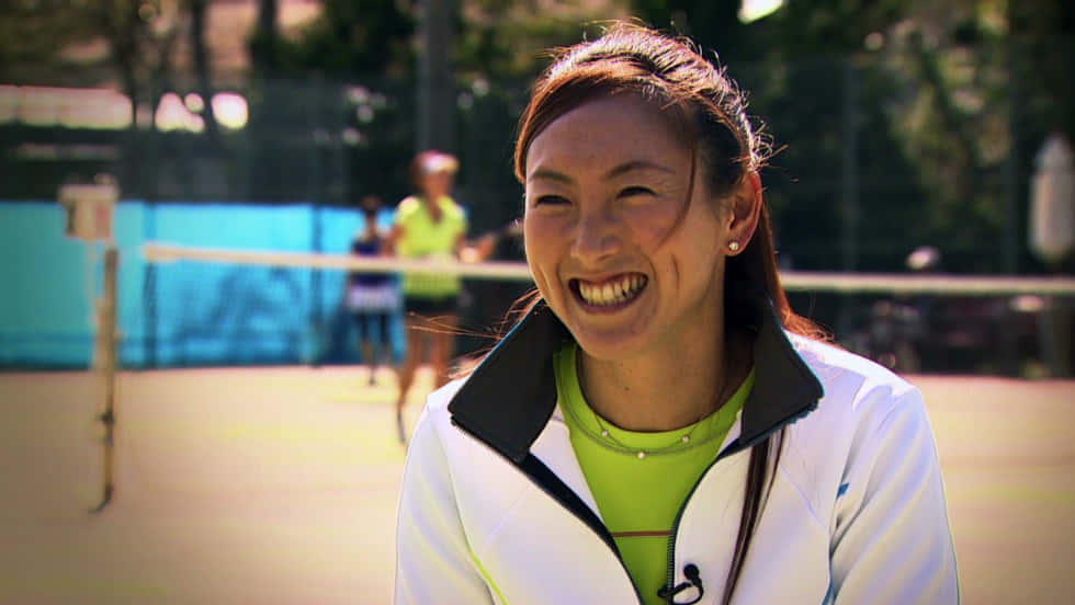 Ai Sugiyama Smiling During An Interview Background