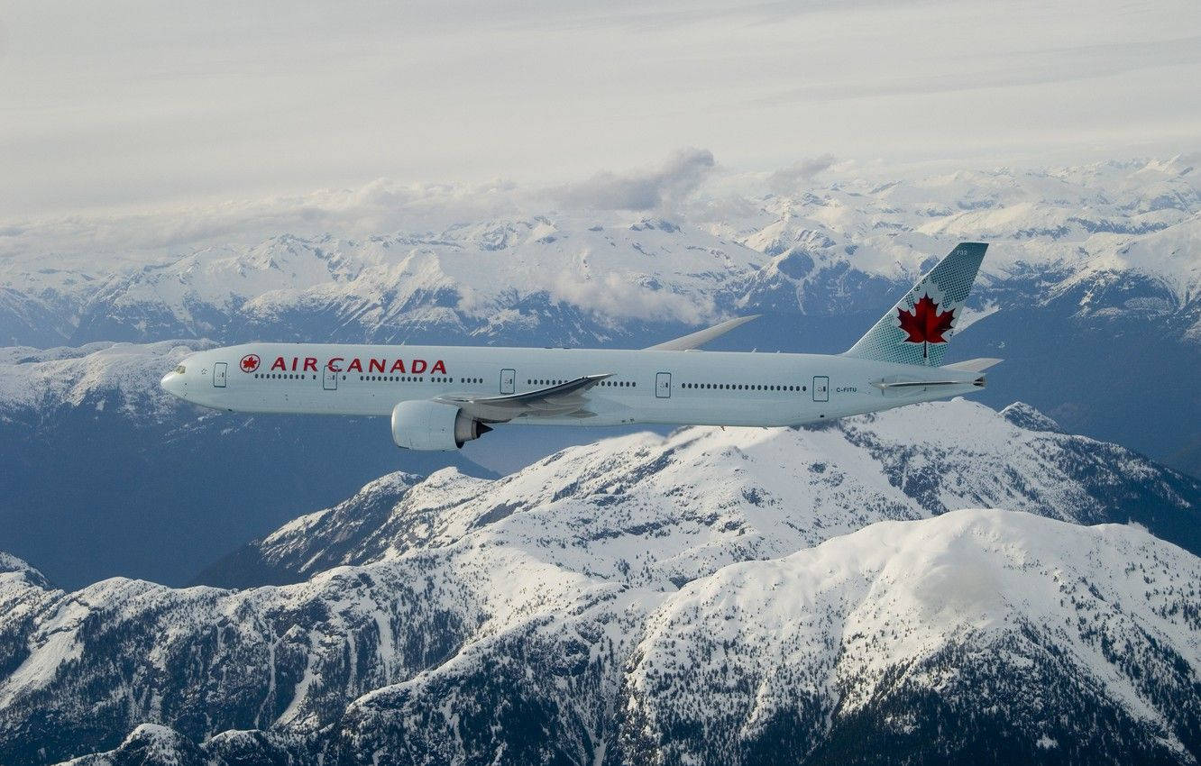 Air Canada Airplane Over Snowy Mountain Background