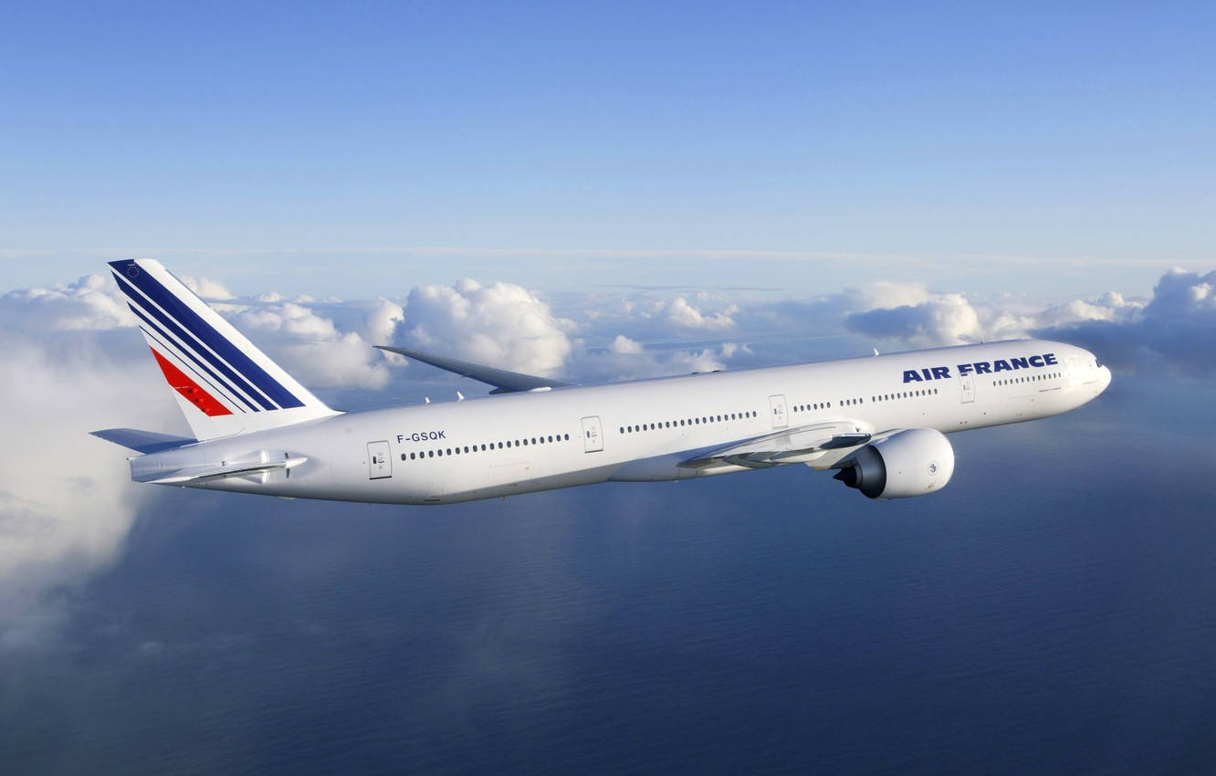 Air France Airline Boeing 777 Plane And Clouds Background