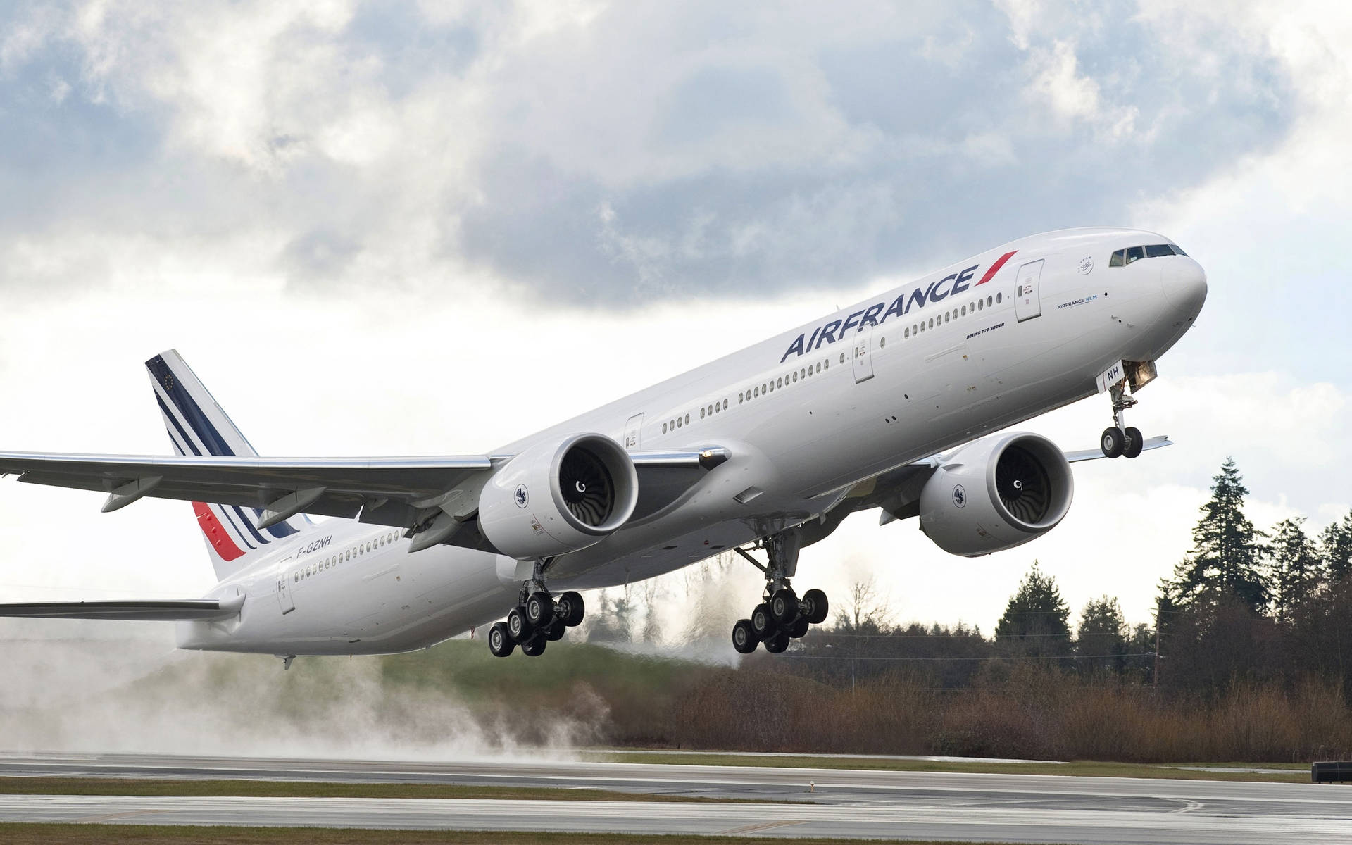 Air France Boeing 777 Plane Flying From Runway Background