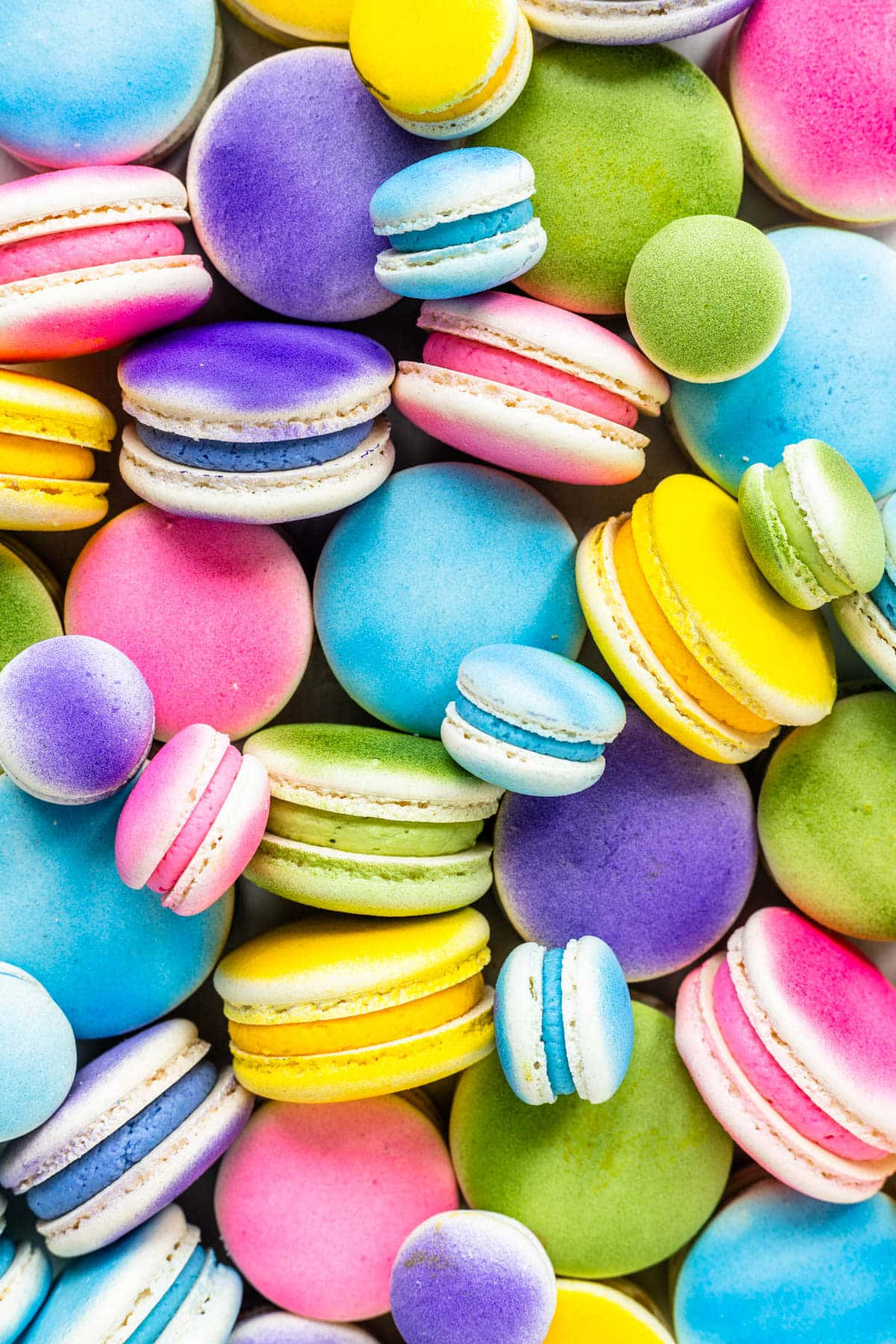 Airbrushed Multicolored French Macaron Shells Background