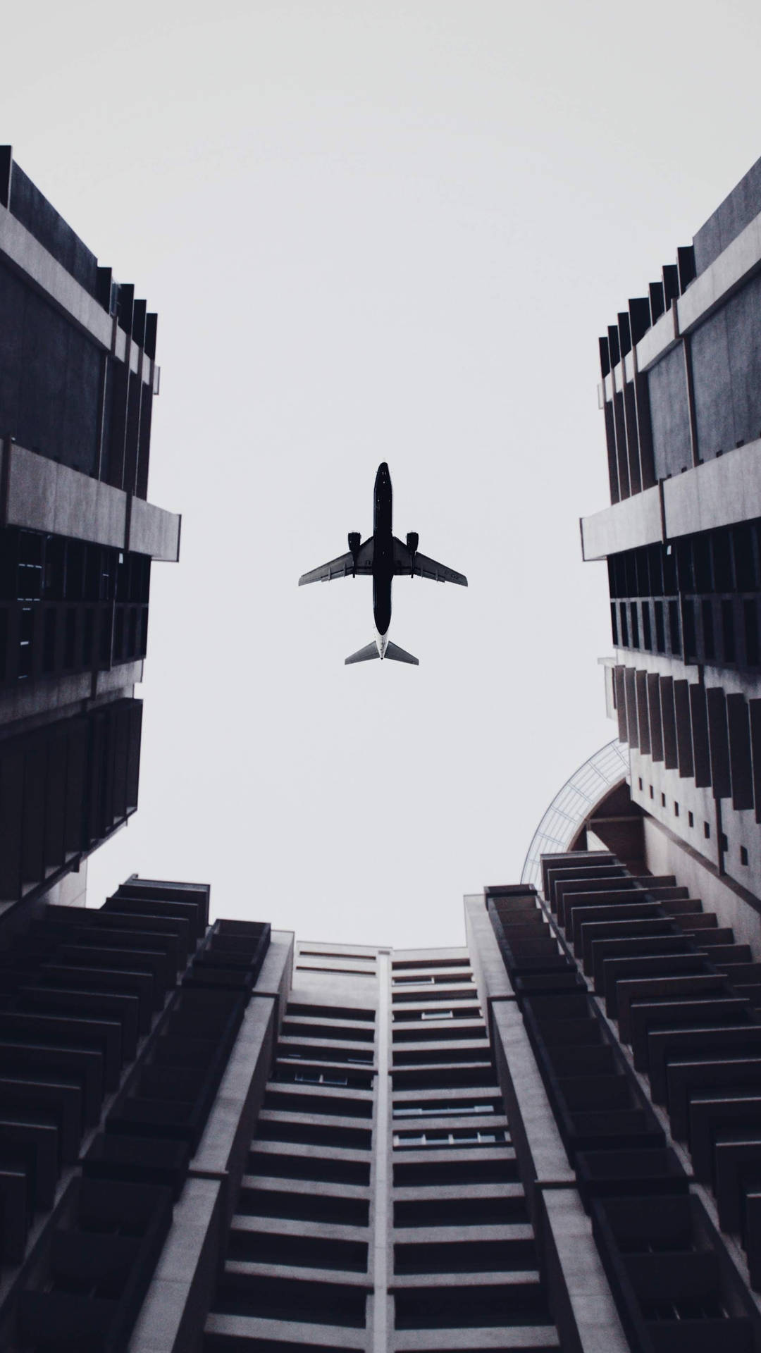 Airplane Above Buildings 2160x3840