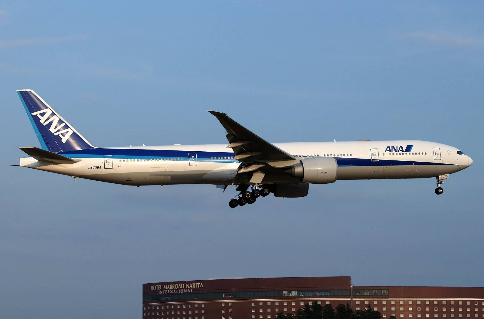 Airplane Above Hotel Marroad Narita International Background