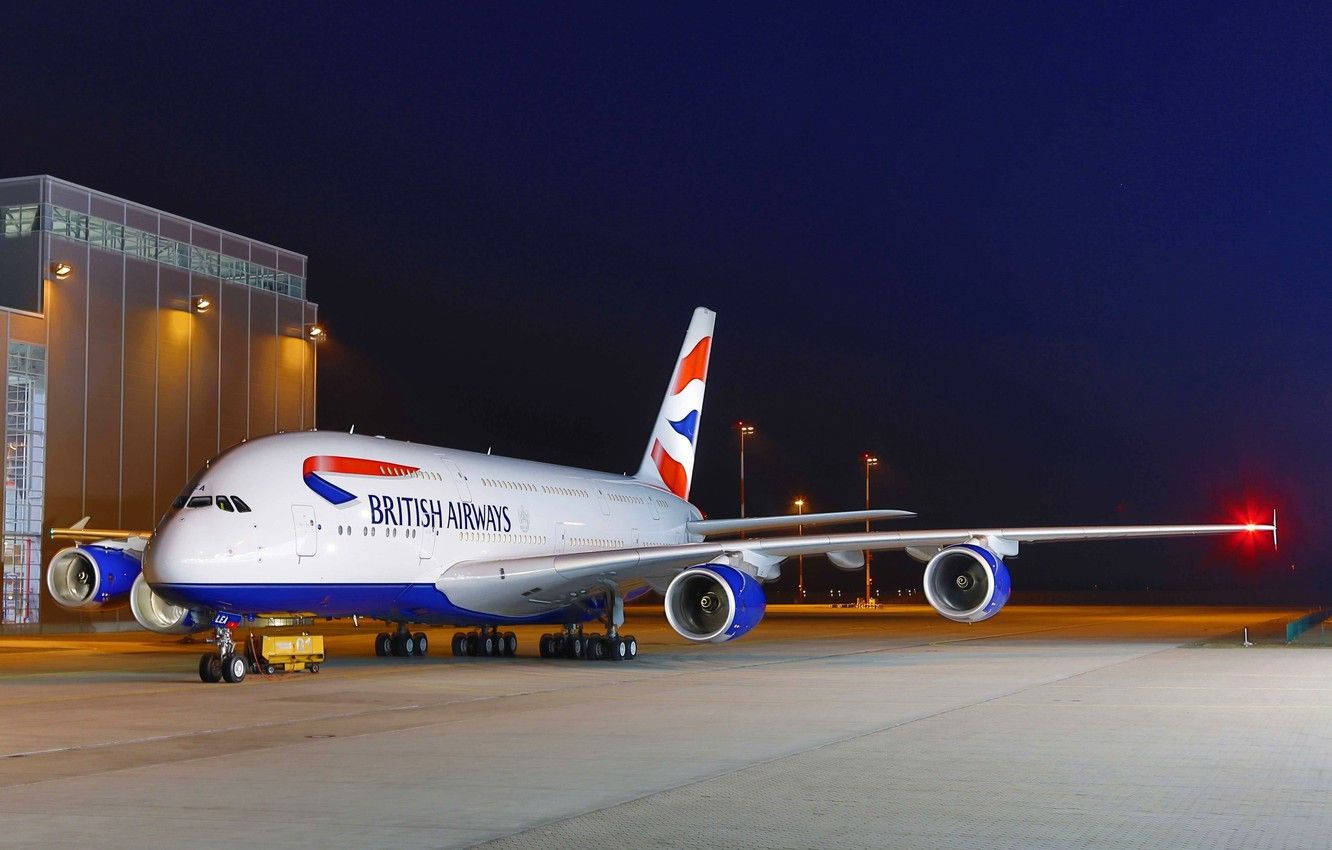 Airplane From British Airways Parked On Runway Background