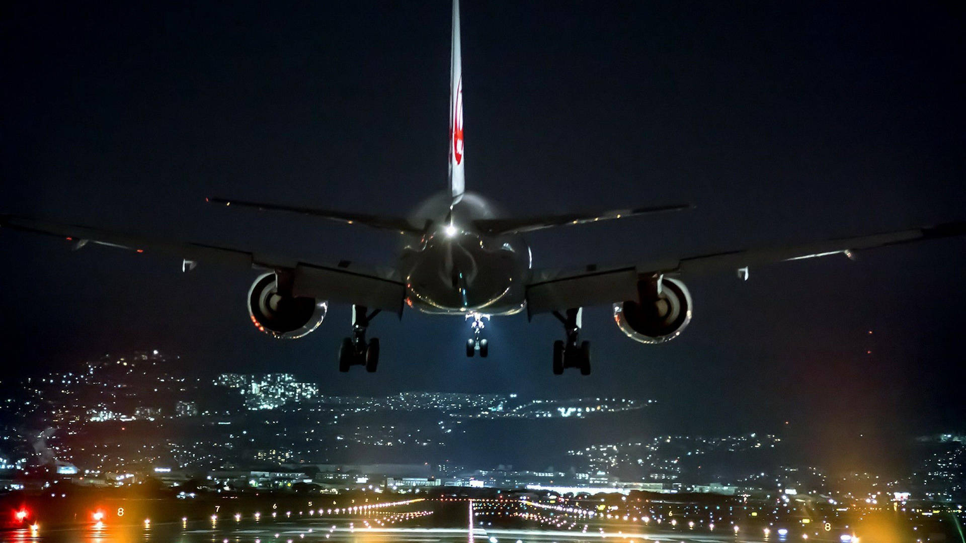 Airplane Landing At Night Background