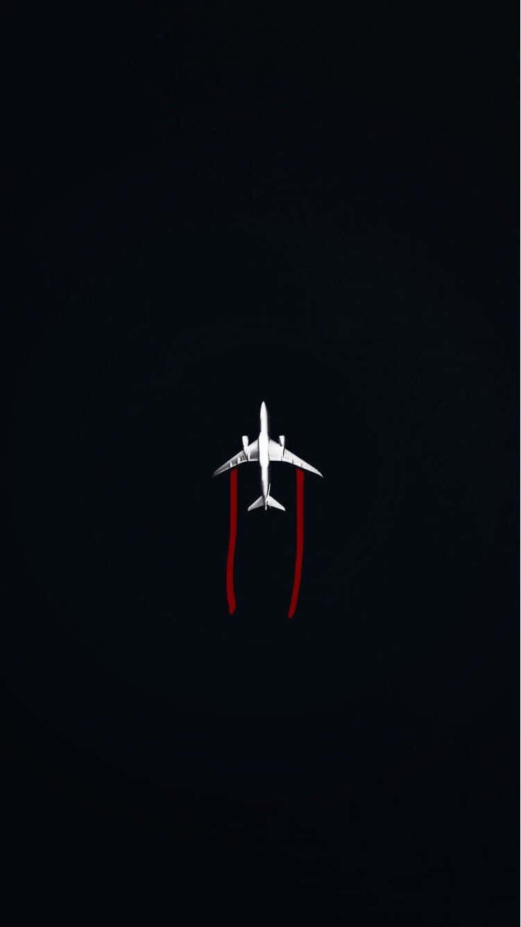 Airplane Overhead Viewwith Red Contrails Background