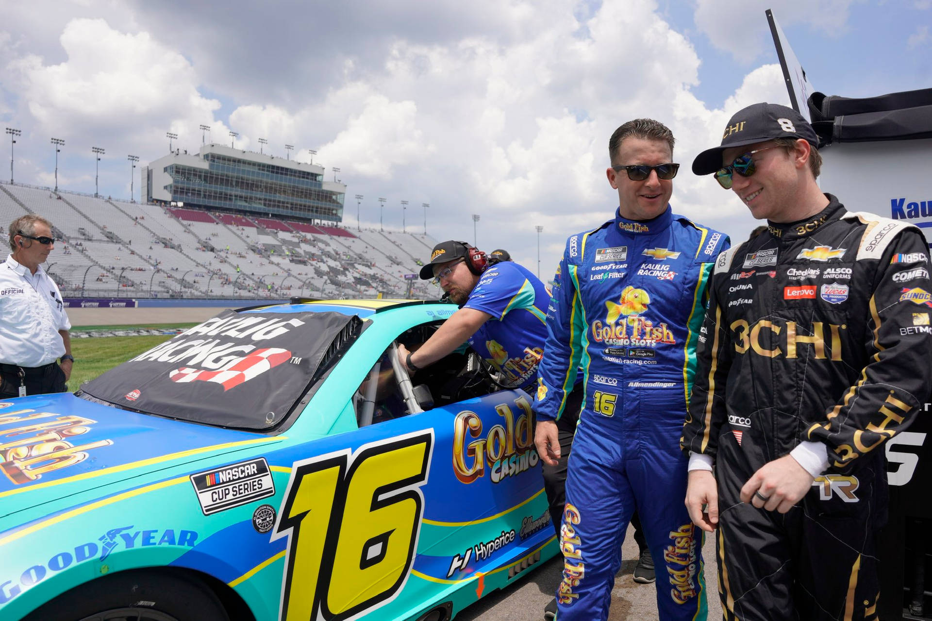 Aj Allmendinger And Noah Cragson Striking A Pose In Racing Attire Background