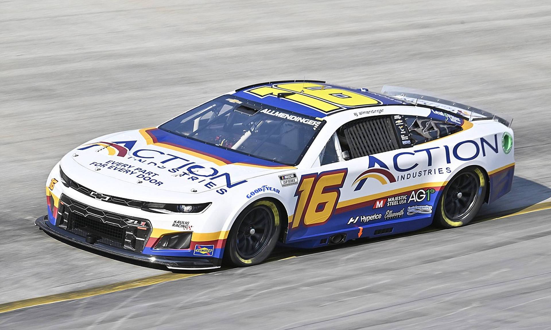 Aj Allmendinger In High-speed Track Action Background