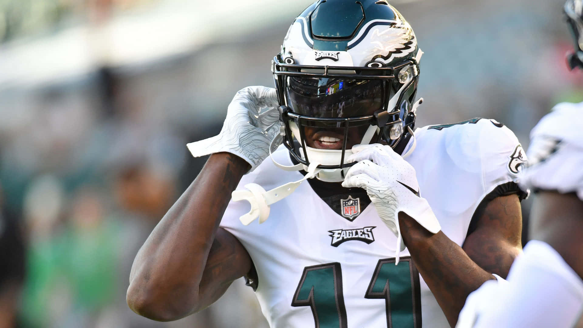 Aj Brown Taking Helmet Off Background