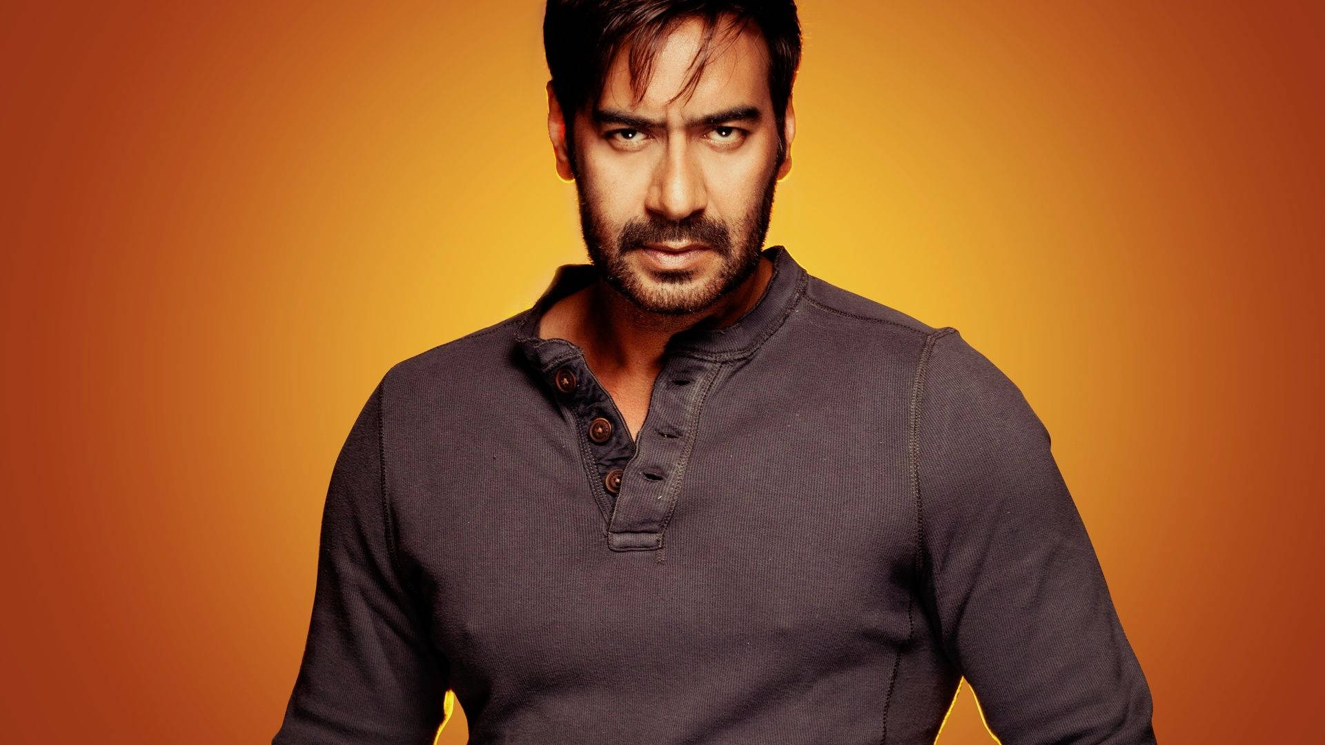 Ajay Devgn Fiery Orange Background