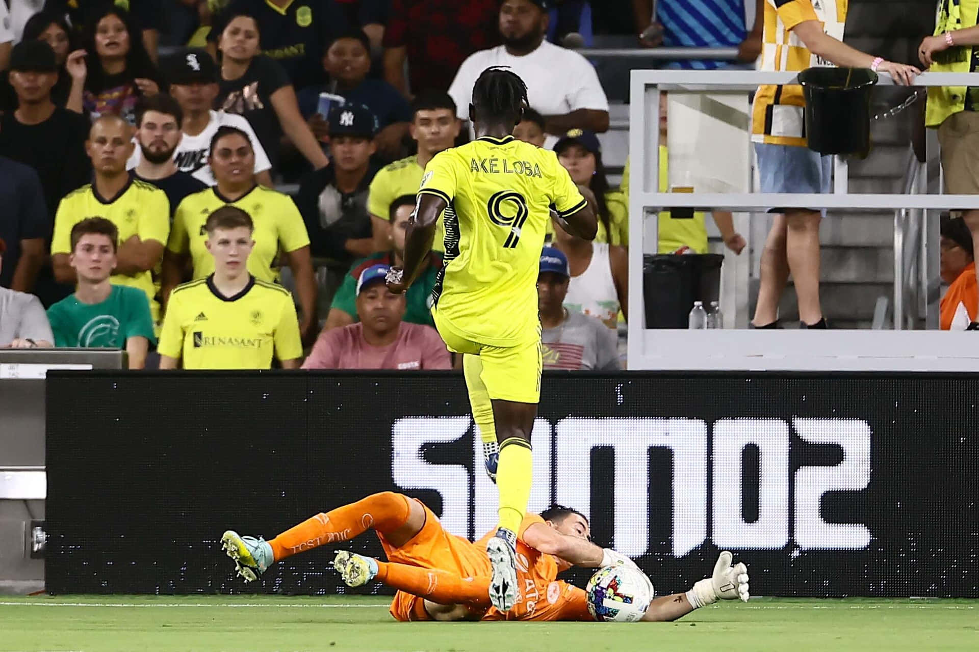 Ake Loba Evading Goalkeeper Challenge Background
