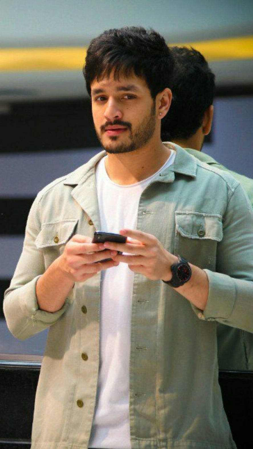 Akhil Akkineni With Phone Background