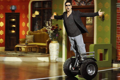 Akshay Kumar Riding Segway Scooter Background