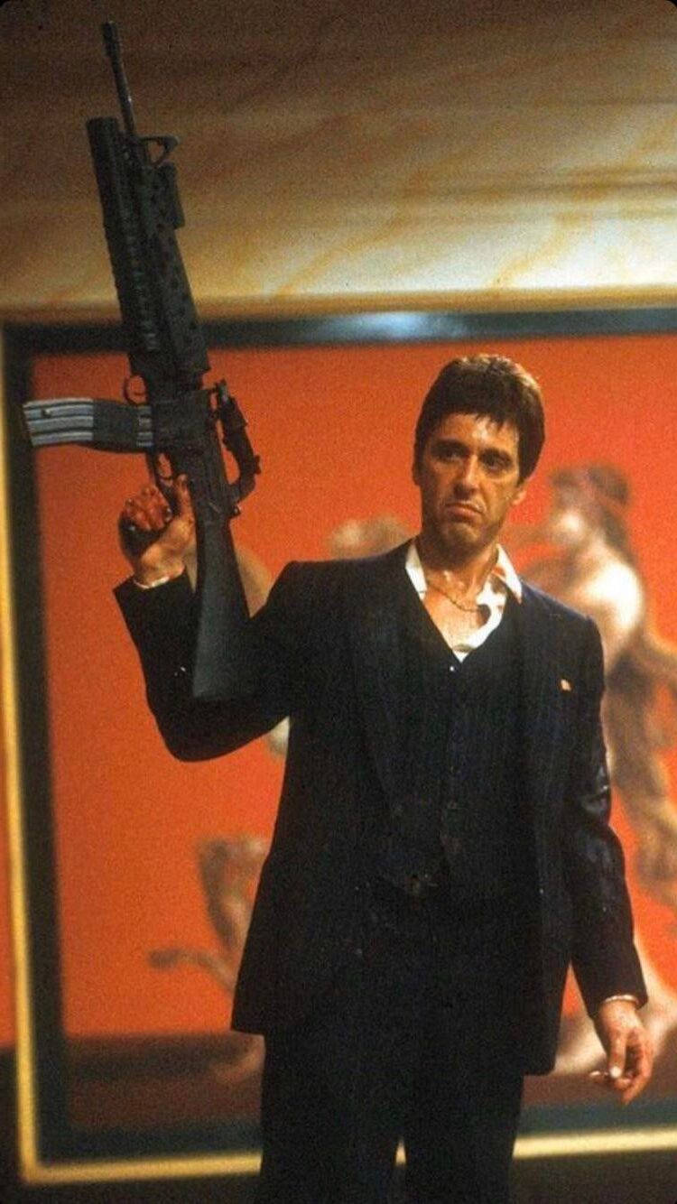Al Pacino Scarface Raising A Gun Background