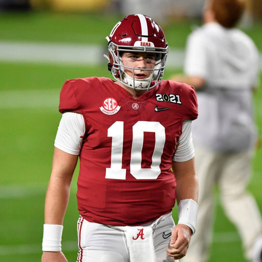 Alabama Football Player In Uniform Walking On The Field