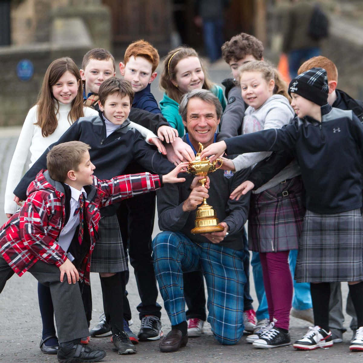 Alan Hansen Photo Op With Kids 2014 Background
