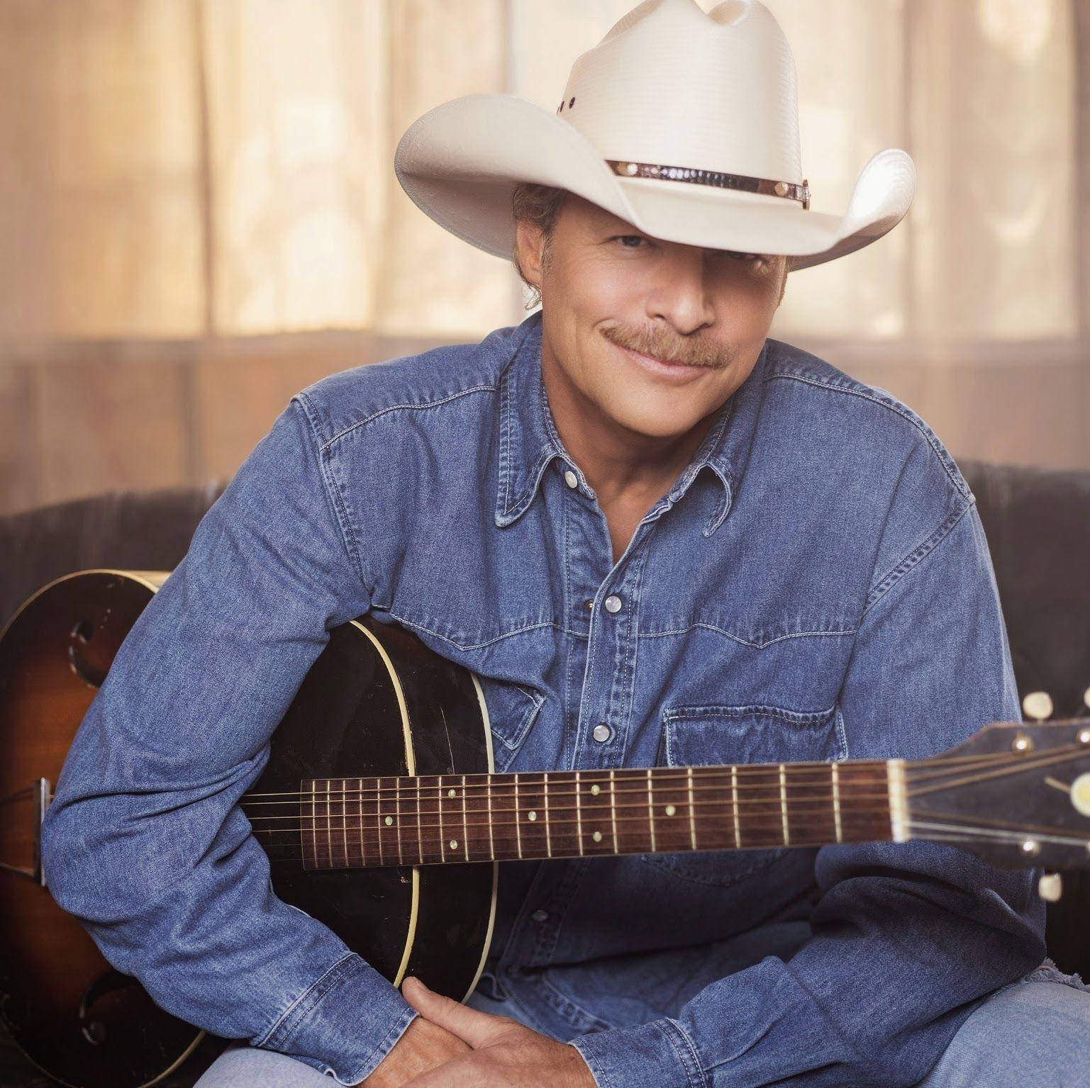 Alan Jackson Against See-through Curtains