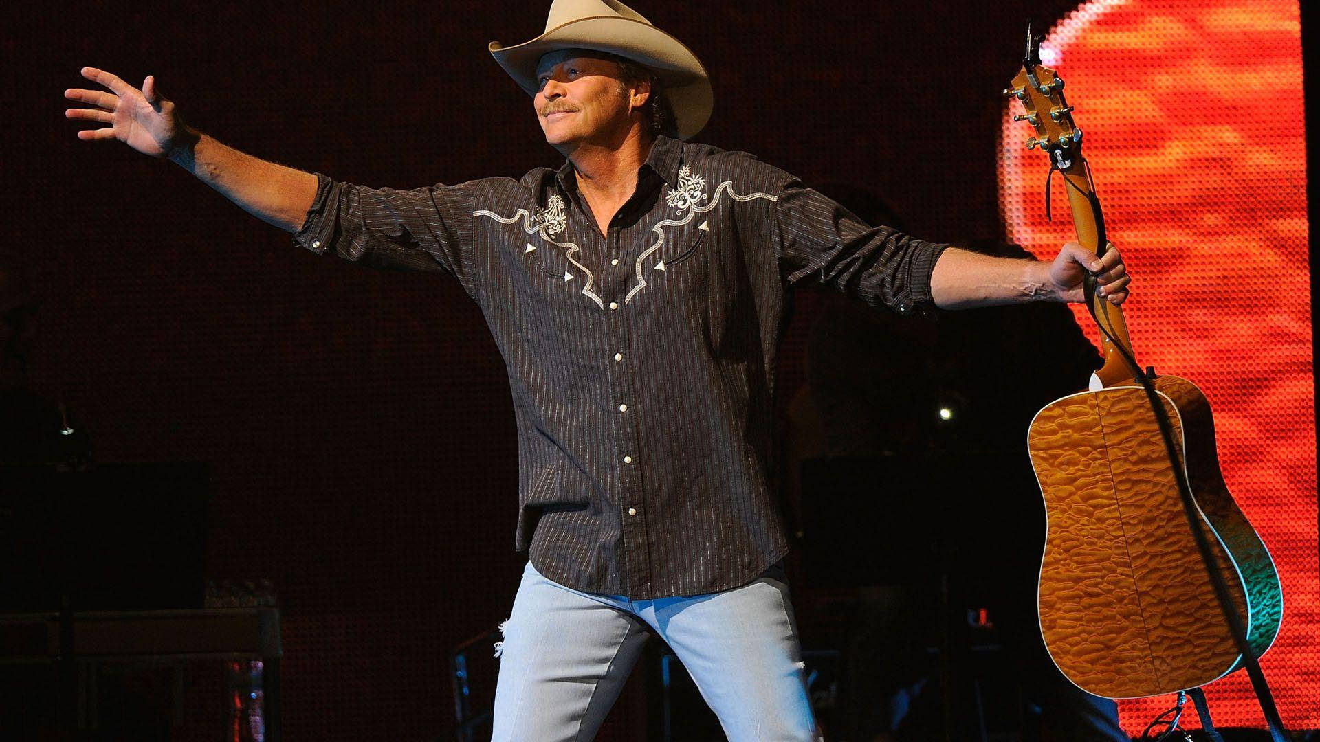 Alan Jackson Arms Open On Stage Background