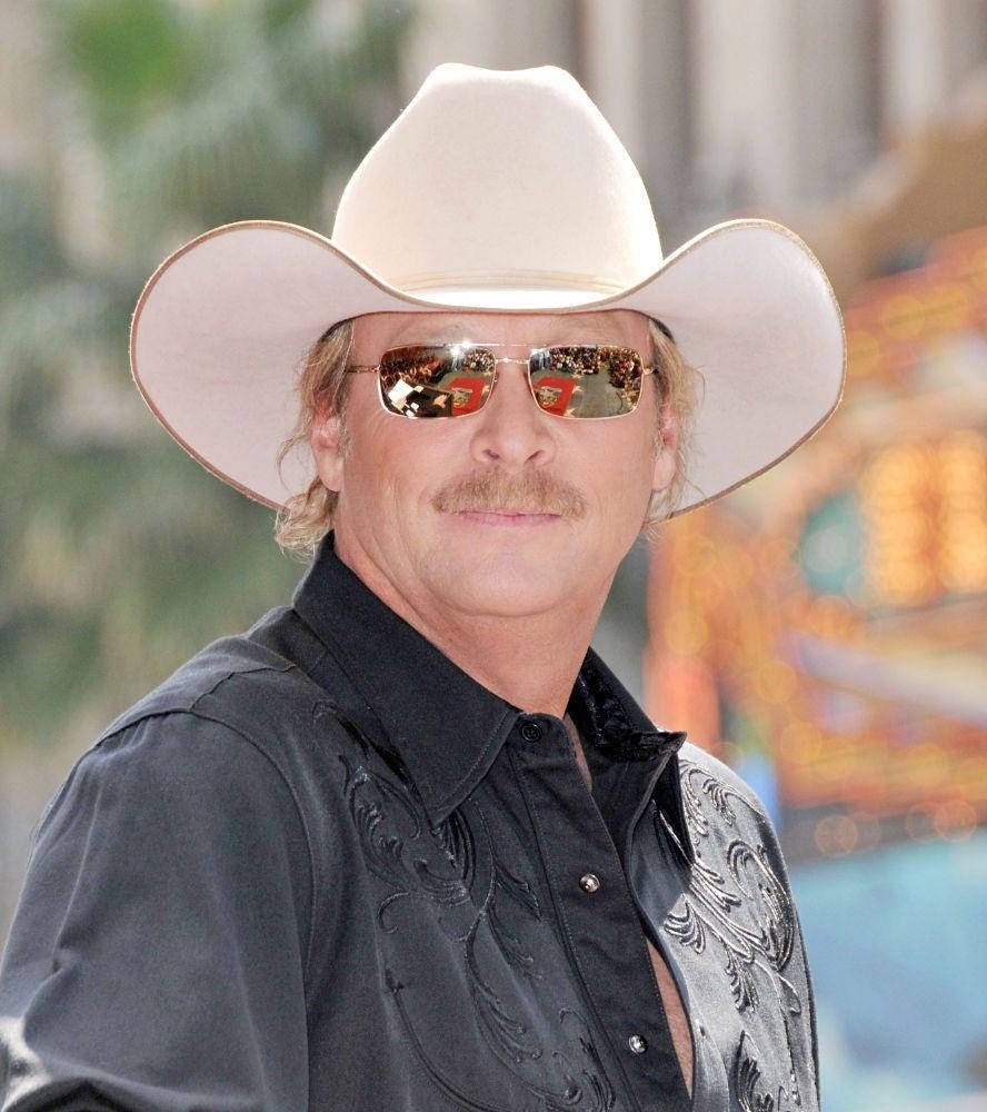 Alan Jackson In Bright Outdoor Setting Background